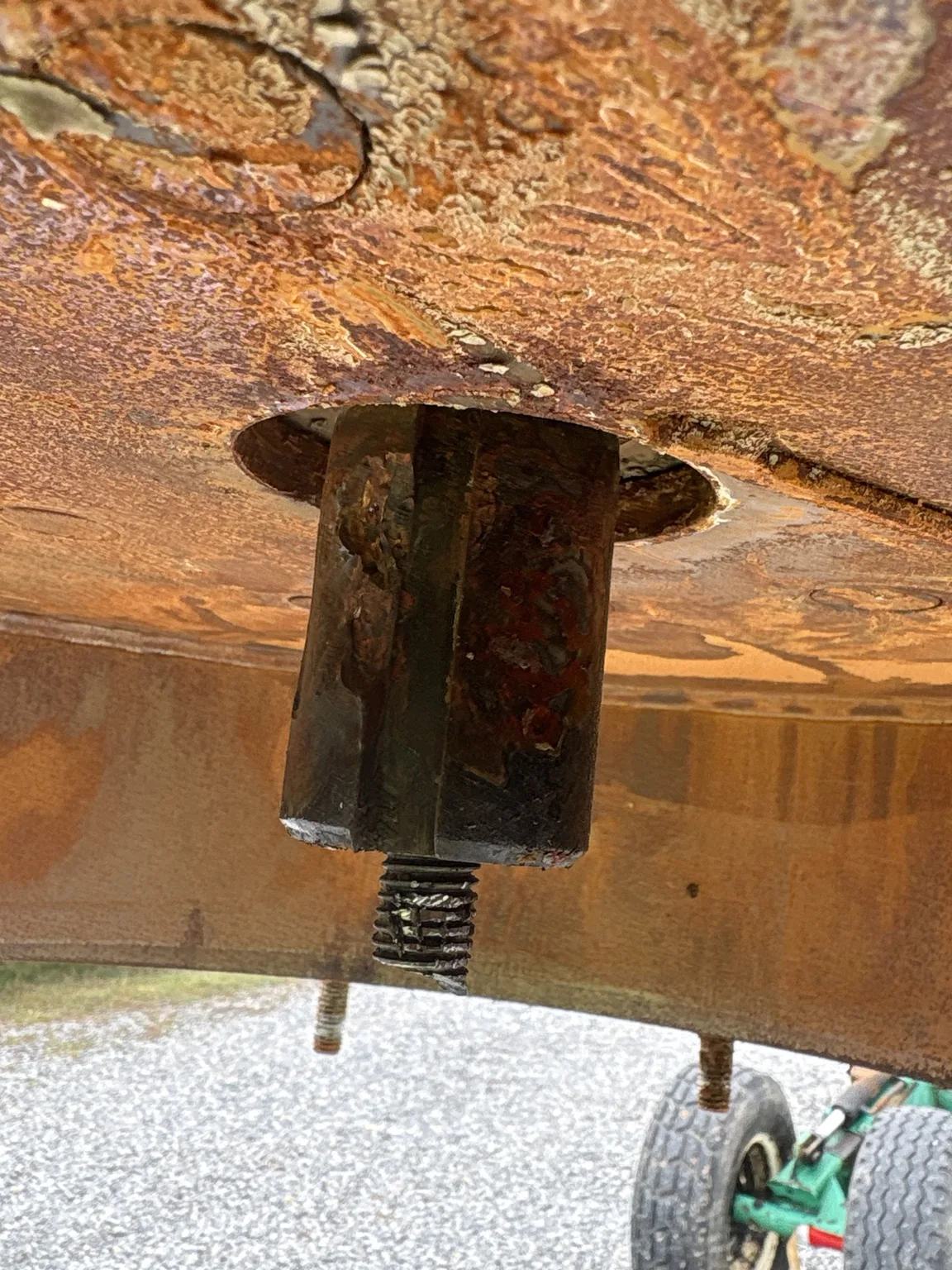 Close view of the pump shaft connection and threaded stud