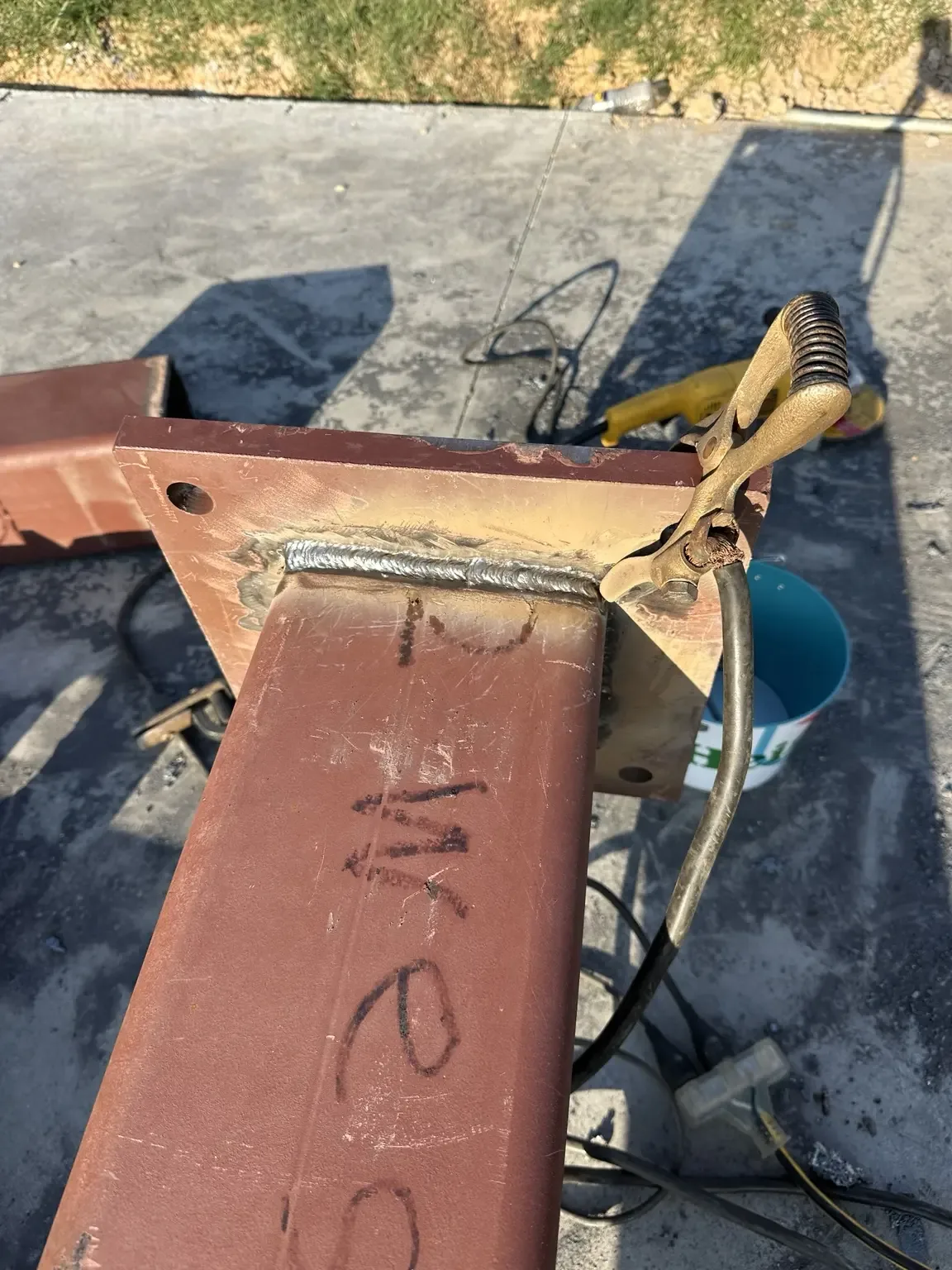 Base plate welded back onto a shortened commercial steel beam