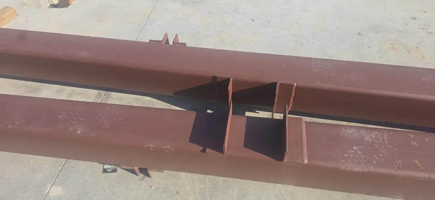 Completed bracket details on modified commercial steel beams