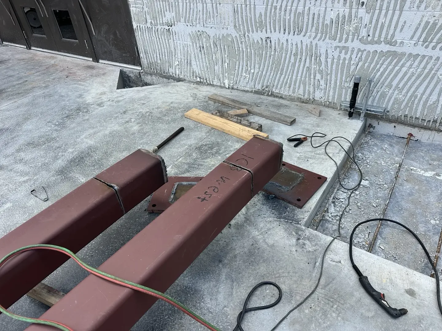 Steel beam ends marked before being cut to the required size
