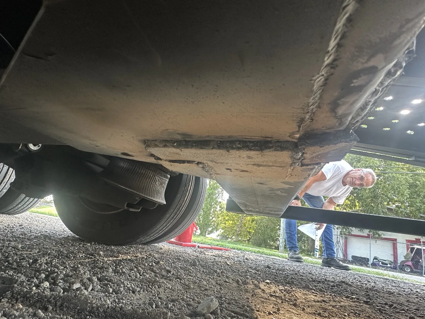 Underside of the completed plated semi-trailer frame repair by K&G Welding in Gadsden