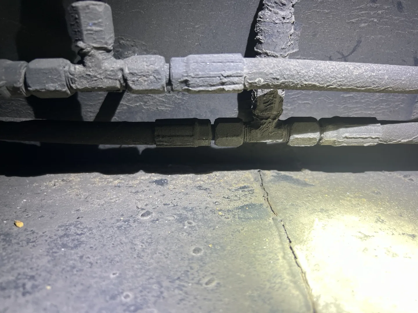 Upper edge of the cracked semi-trailer frame section with surrounding lines visible