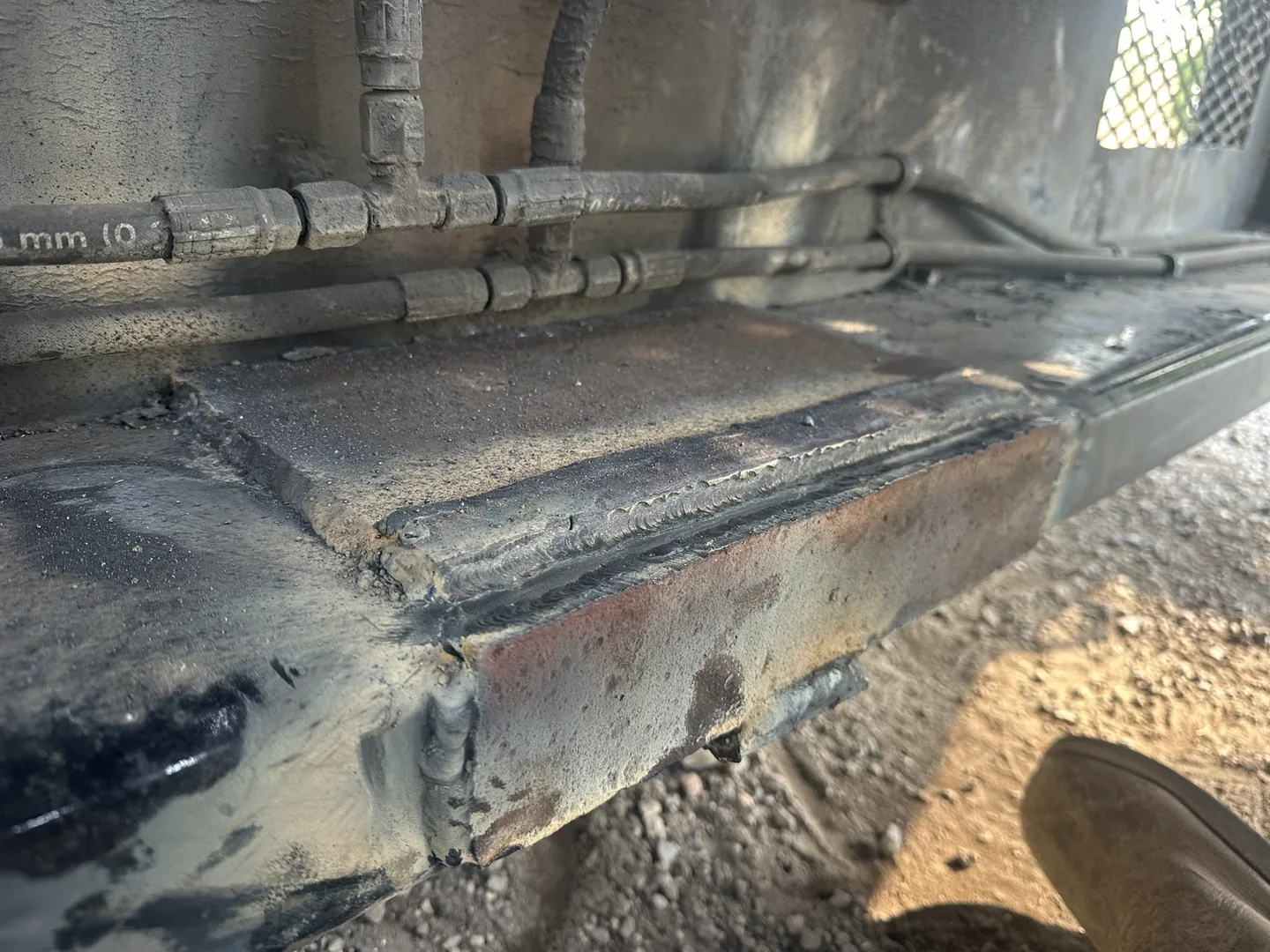 Steel reinforcement plates welded over the repaired semi-trailer frame section in Gadsden
