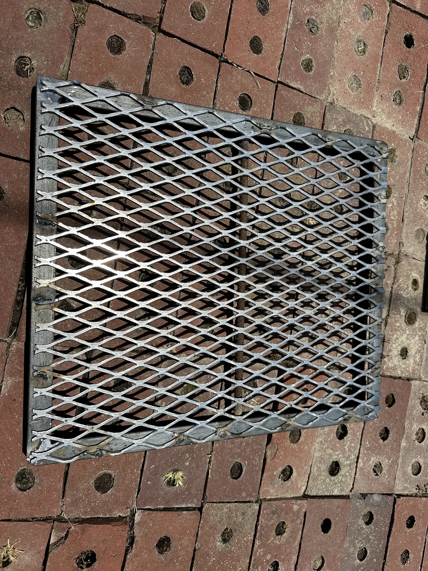 Newly fabricated expanded-metal grill grate after repair