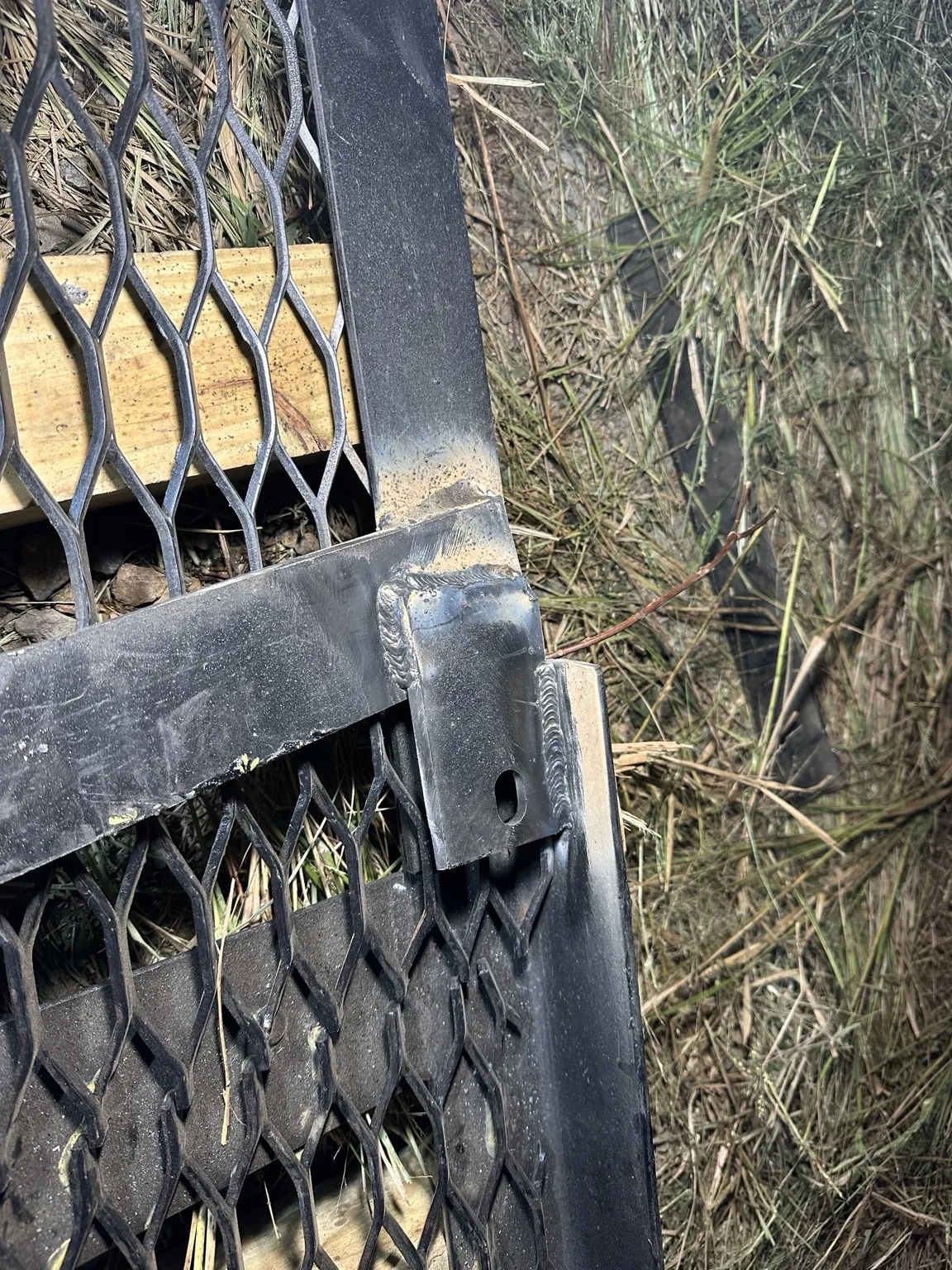 Welded slotted bracket and crossmember connection on the billboard frame