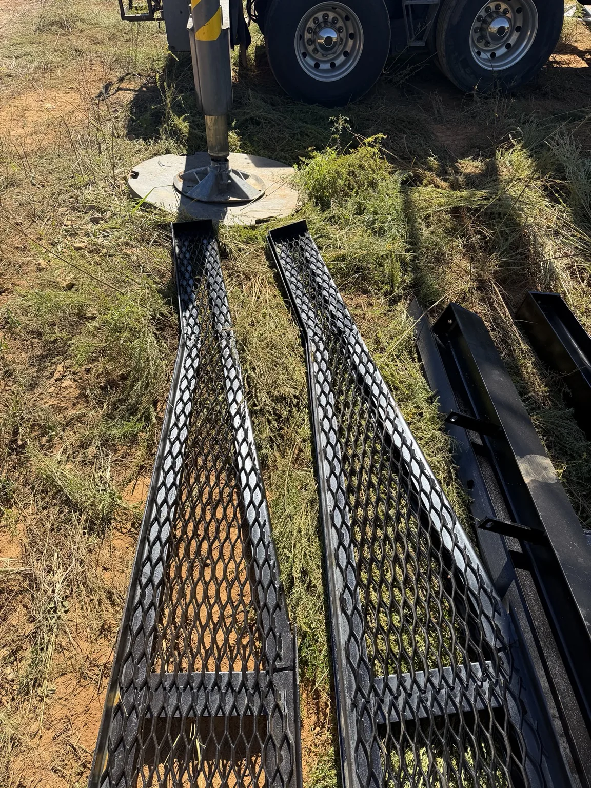 Billboard steel assembly with expanded-metal sections laid out at the Guntersville jobsite