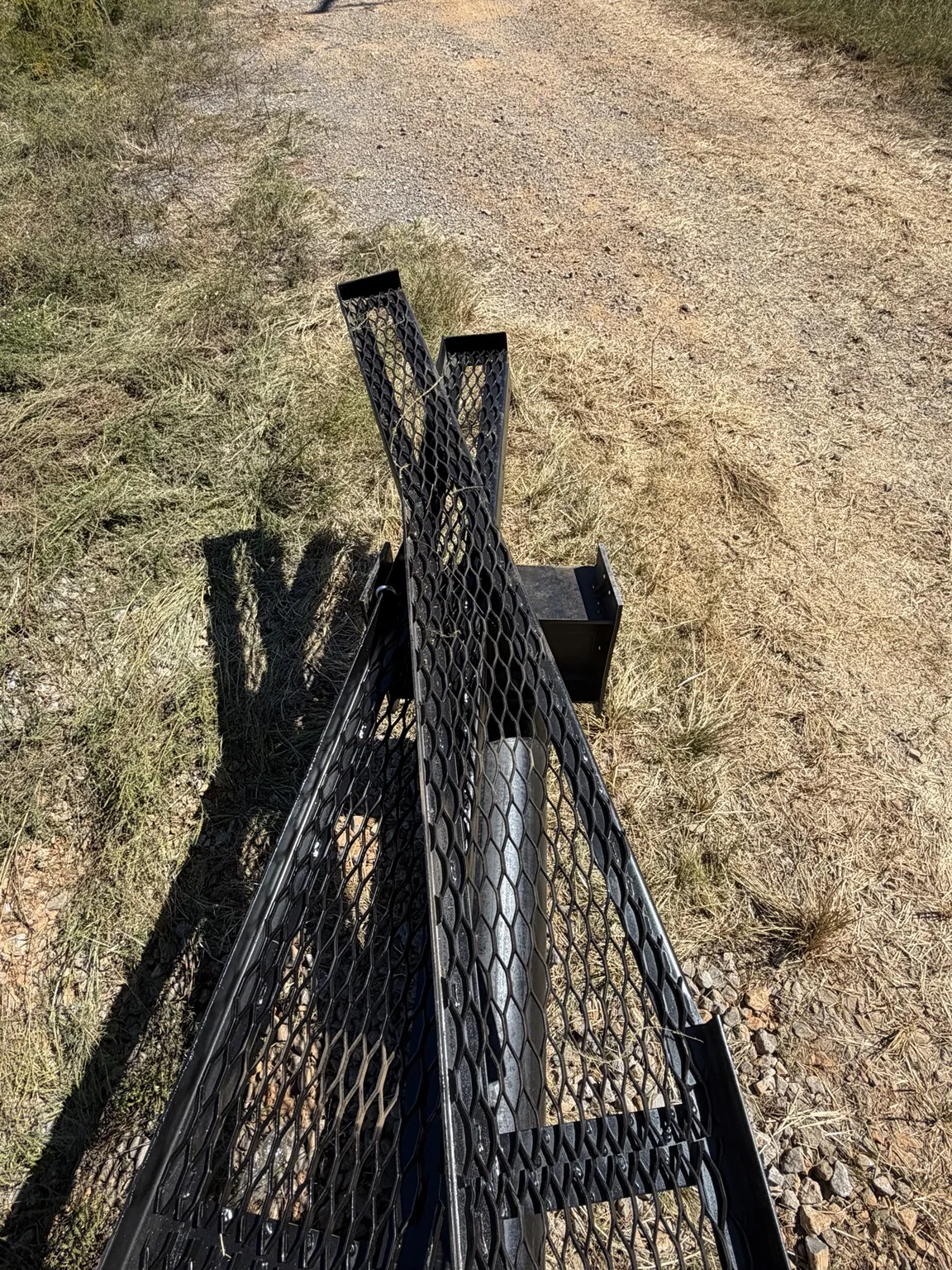 Billboard frame and expanded-metal sections viewed from the opposite end