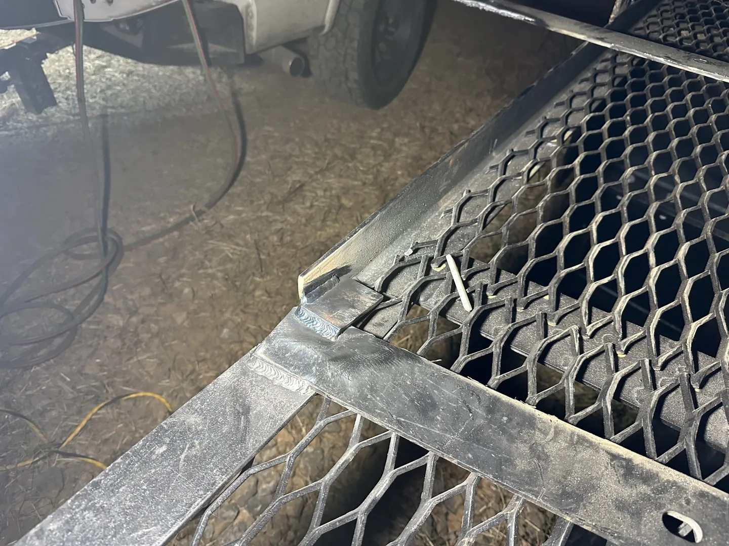 Close view of welds joining the billboard frame and crossmember during the Guntersville correction