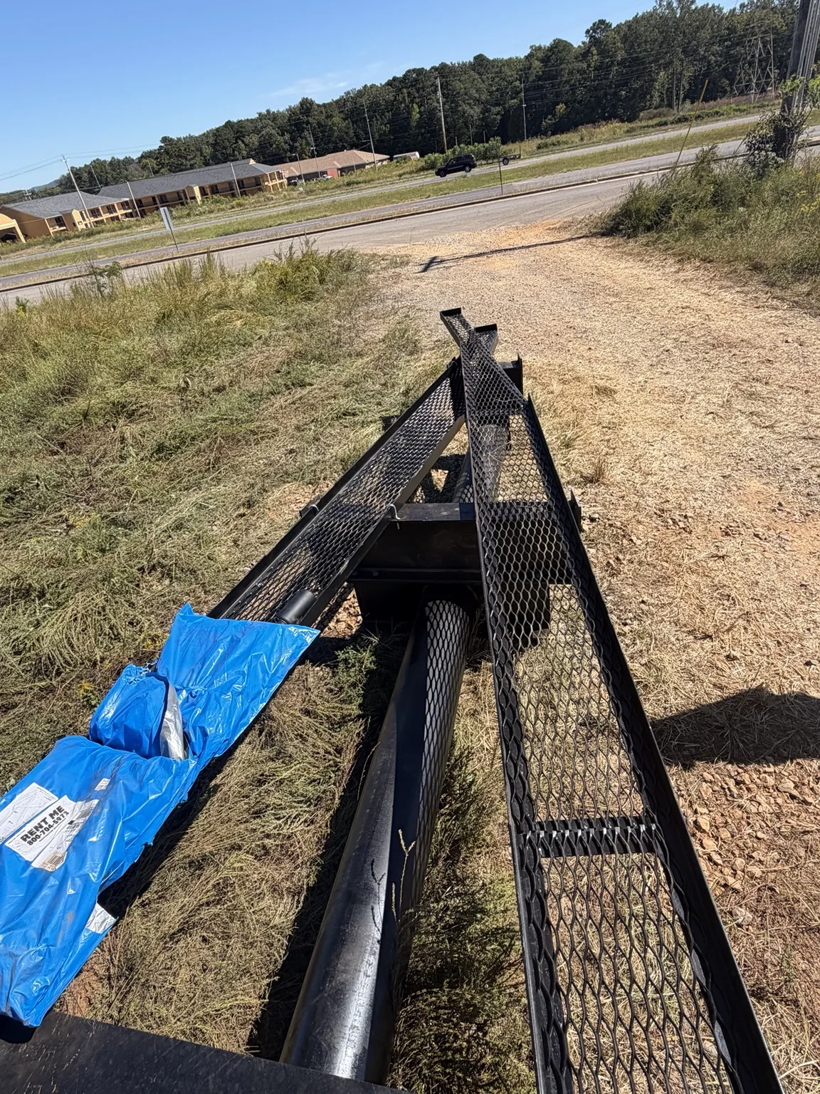 Wider view of the billboard steel assembly and work area in Guntersville, Alabama