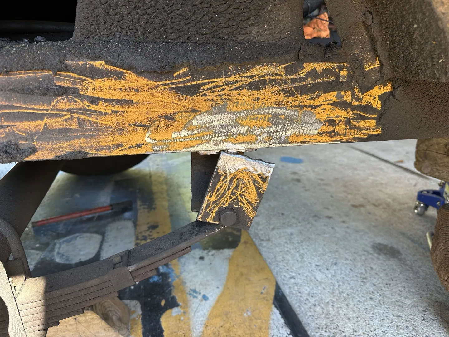 Failed trailer spring-mounting bracket separated from the frame before repair in Jacksonville, Alabama