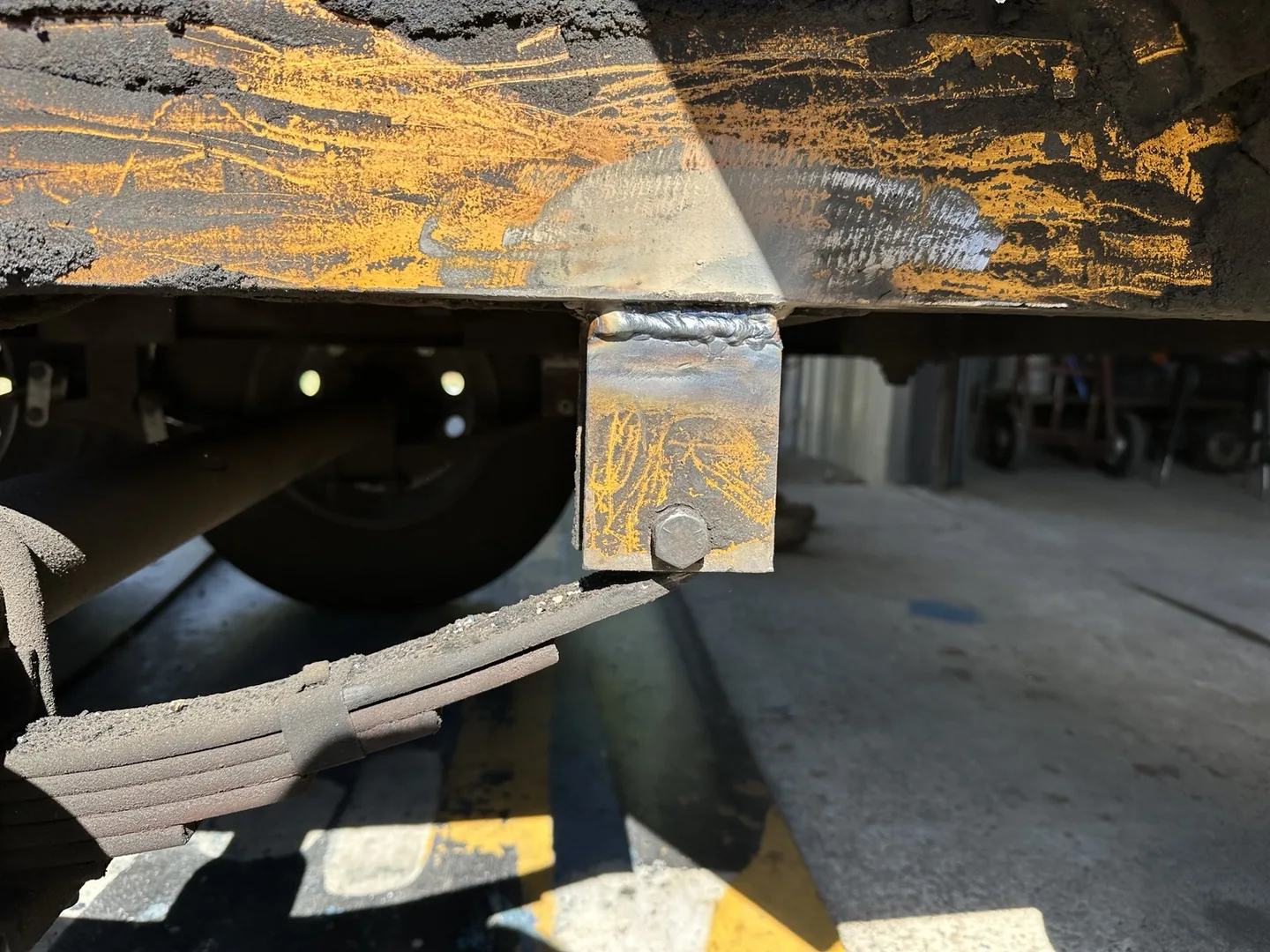 Completed weld joining the spring bracket to the trailer frame in Jacksonville