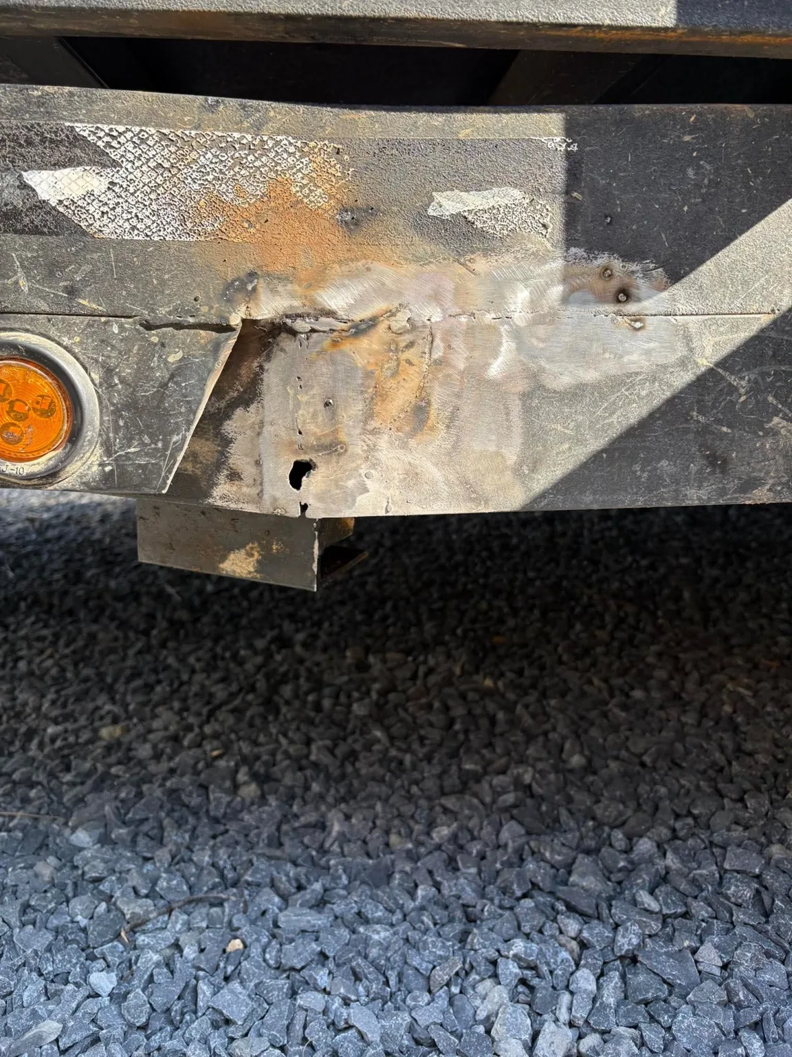 Damaged trailer frame before repair