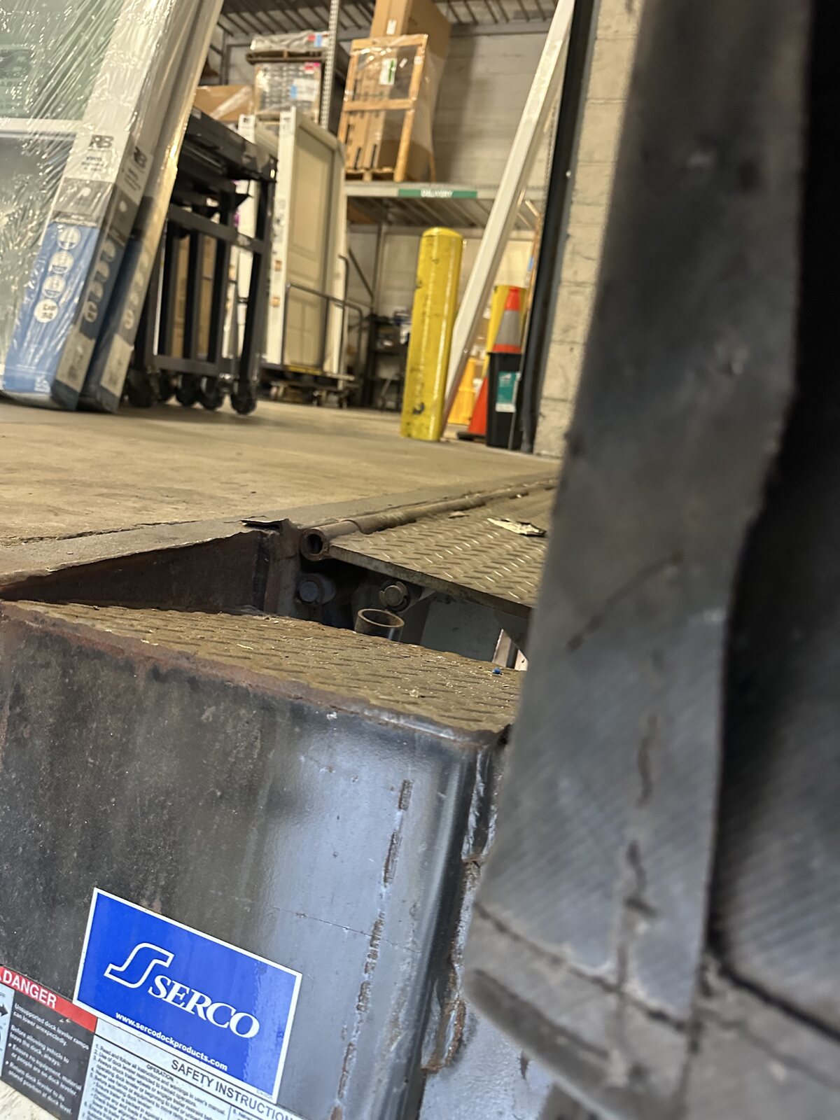 Commercial loading dock steel repair area during on-site welding work